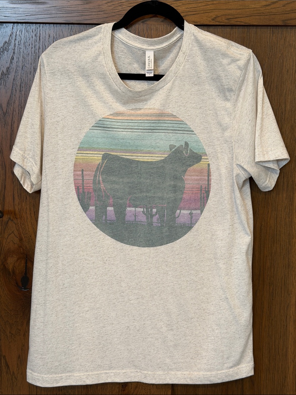 Bella Canvas Heather Cream Tee with Desert Sunset Cow Graphic
